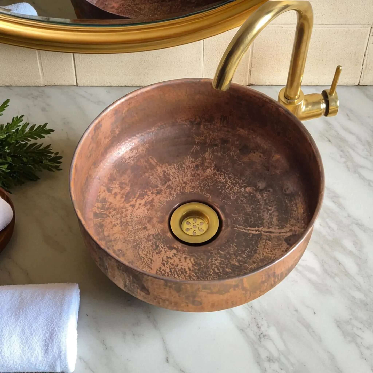 Rustic Copper Bathroom Sink with a stylish faucet and marble countertop, adding a warm touch to the bathroom decor.
