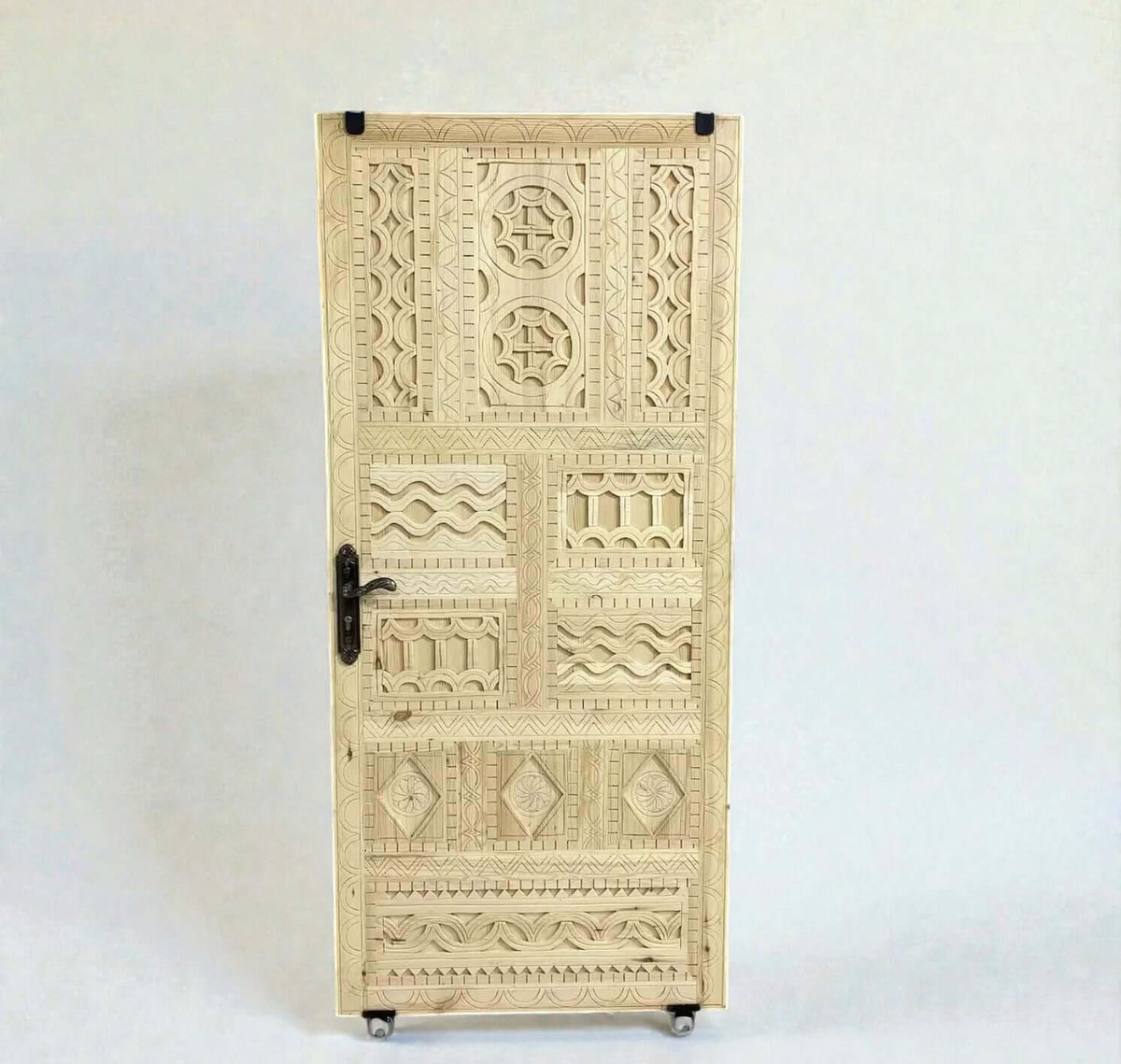 Hand-carved Moroccan wooden door with Moorish design