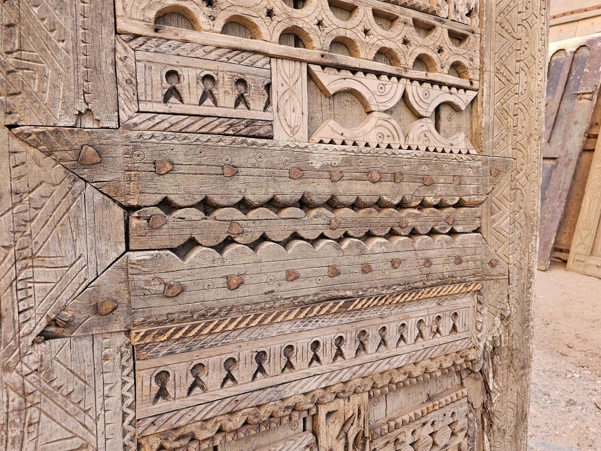 Romantic antique wooden door with traditional flower motifs