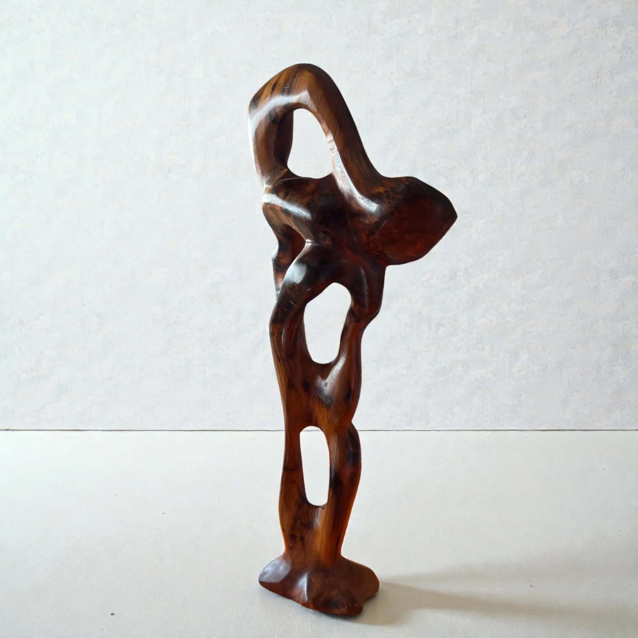 Abstract wooden sculpture side view with natural wood grain