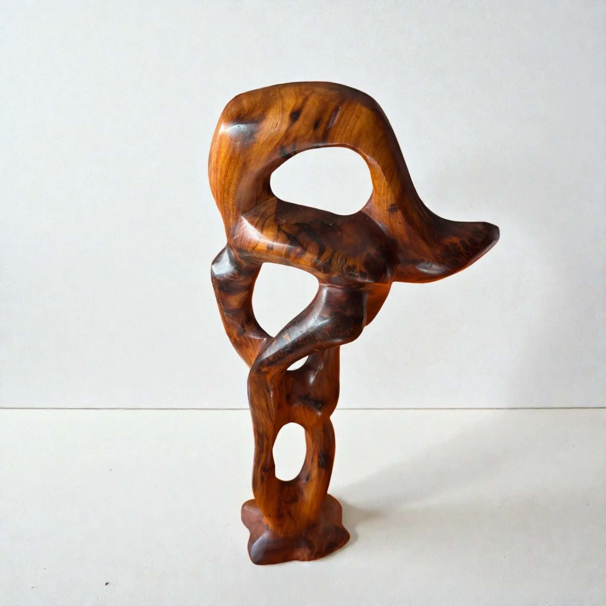 Abstract wood sculpture with organic carved form for shelf decor