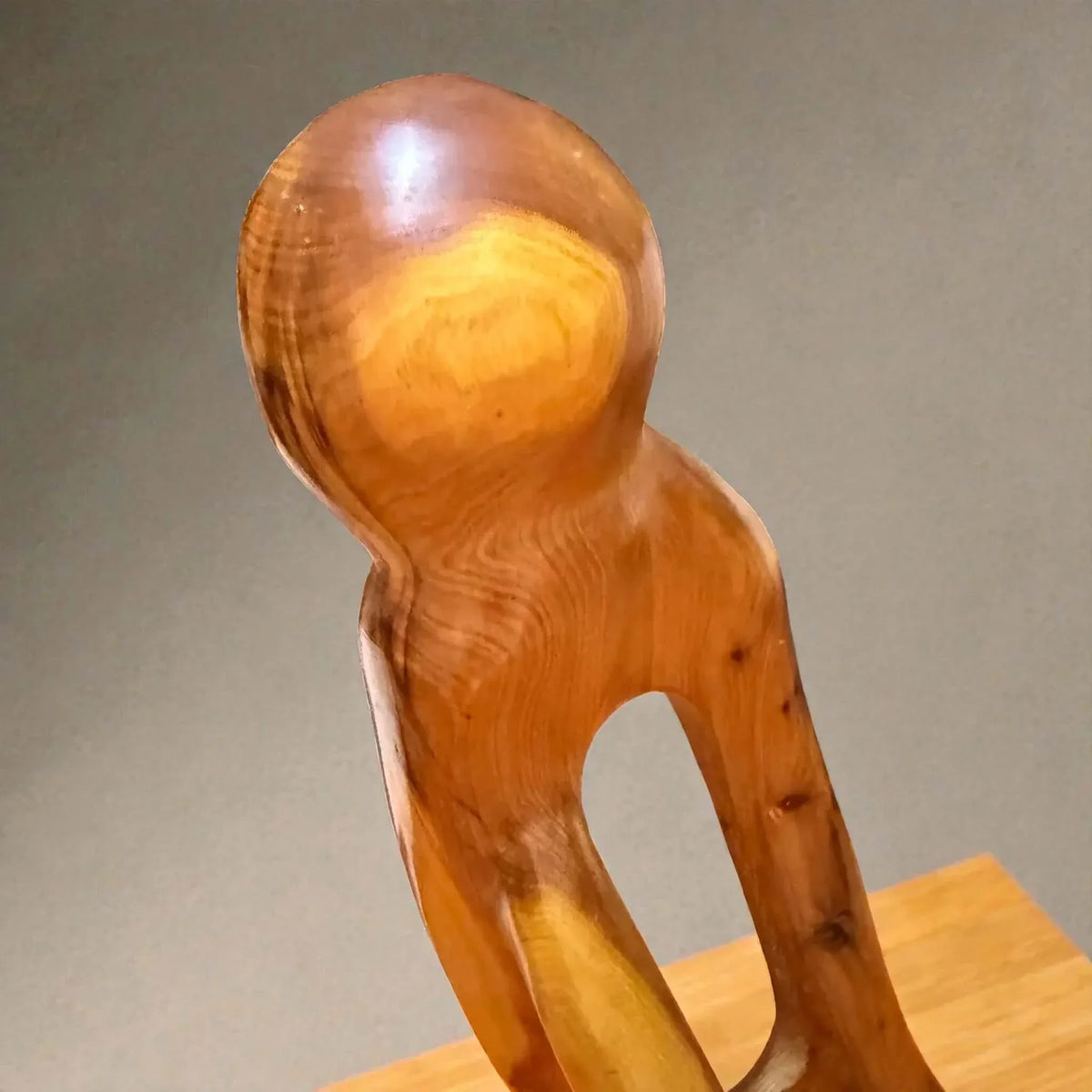 Wooden shelf sculpture with natural grain for home decor
