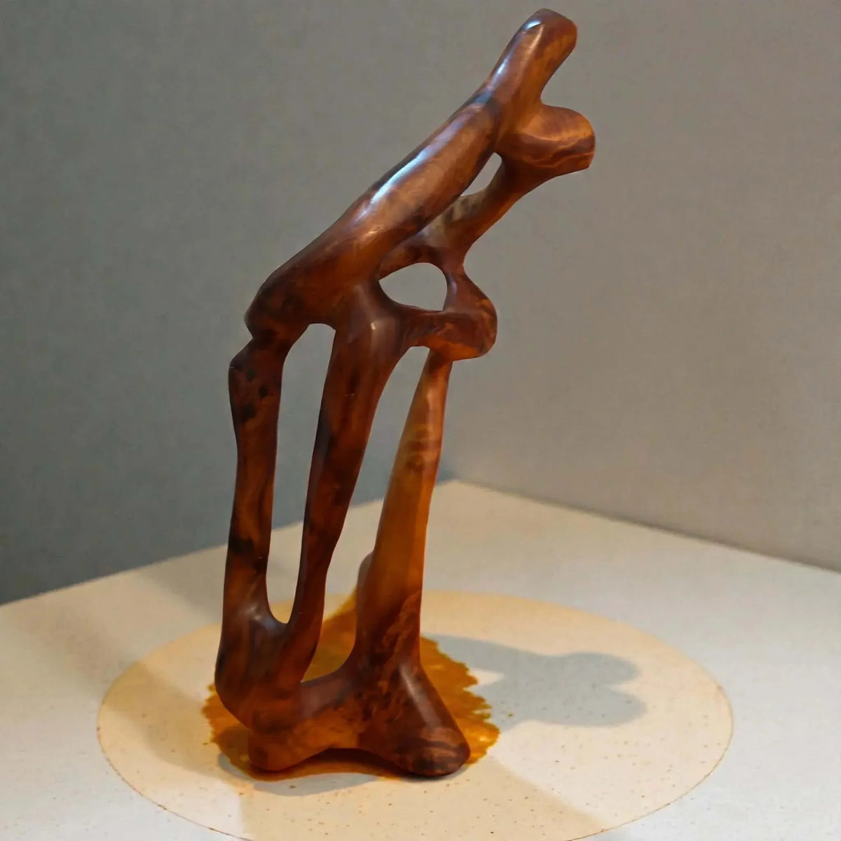Hand-carved wooden sculpture with natural wood grain detail