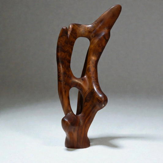 Hand-carved abstract wooden sculpture made from Moroccan Thuya wood on a clean white background.