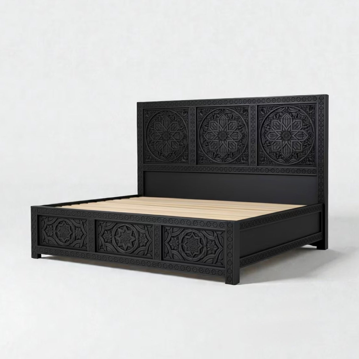 Black bed frame with decorative patterns on a white background