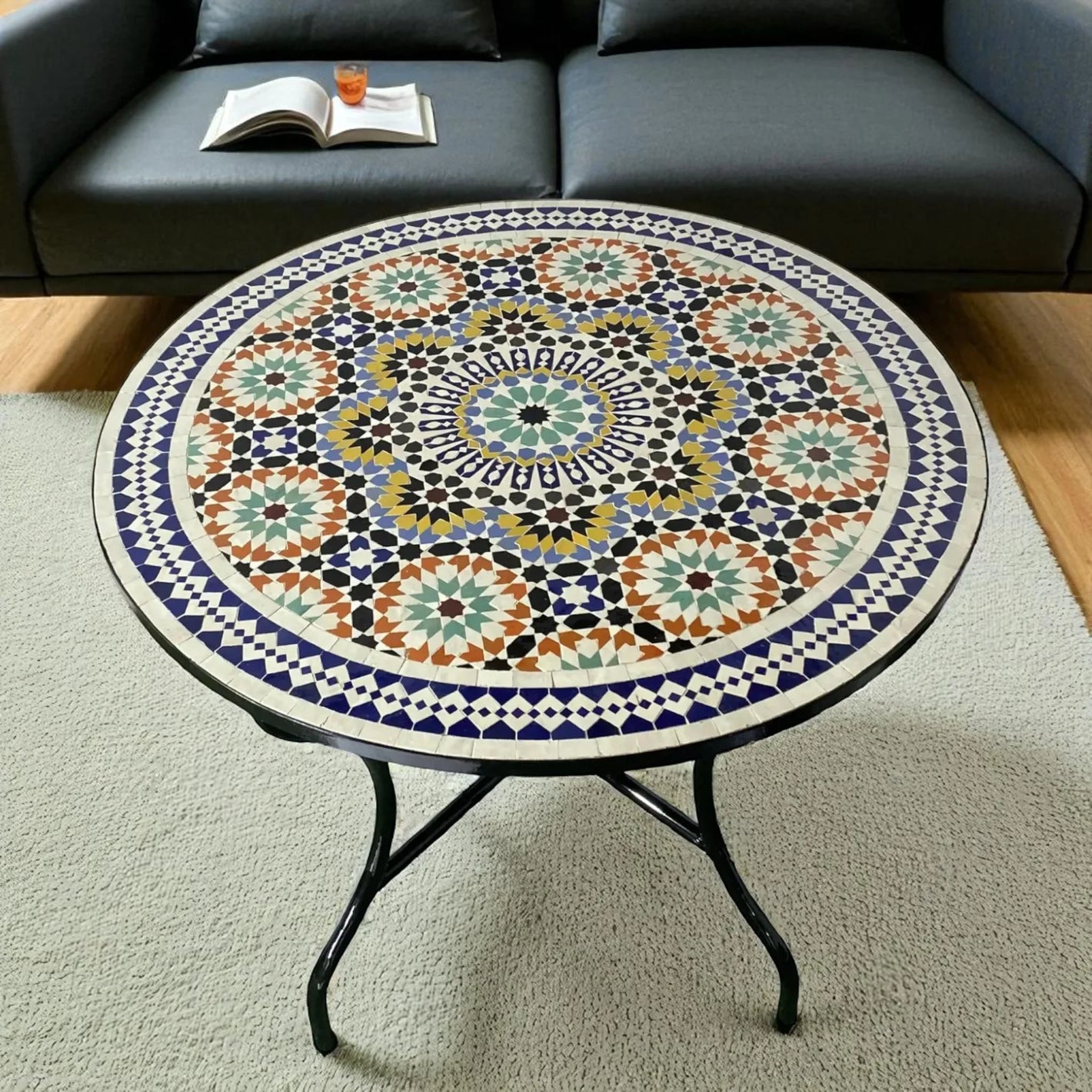 Handcrafted zellige mosaic tables made with natural marble and glazed tiles. Stunning centerpieces for gardens, patios, and living rooms.
