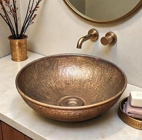 Side profile of hammered copper vessel sink crafted from solid copper