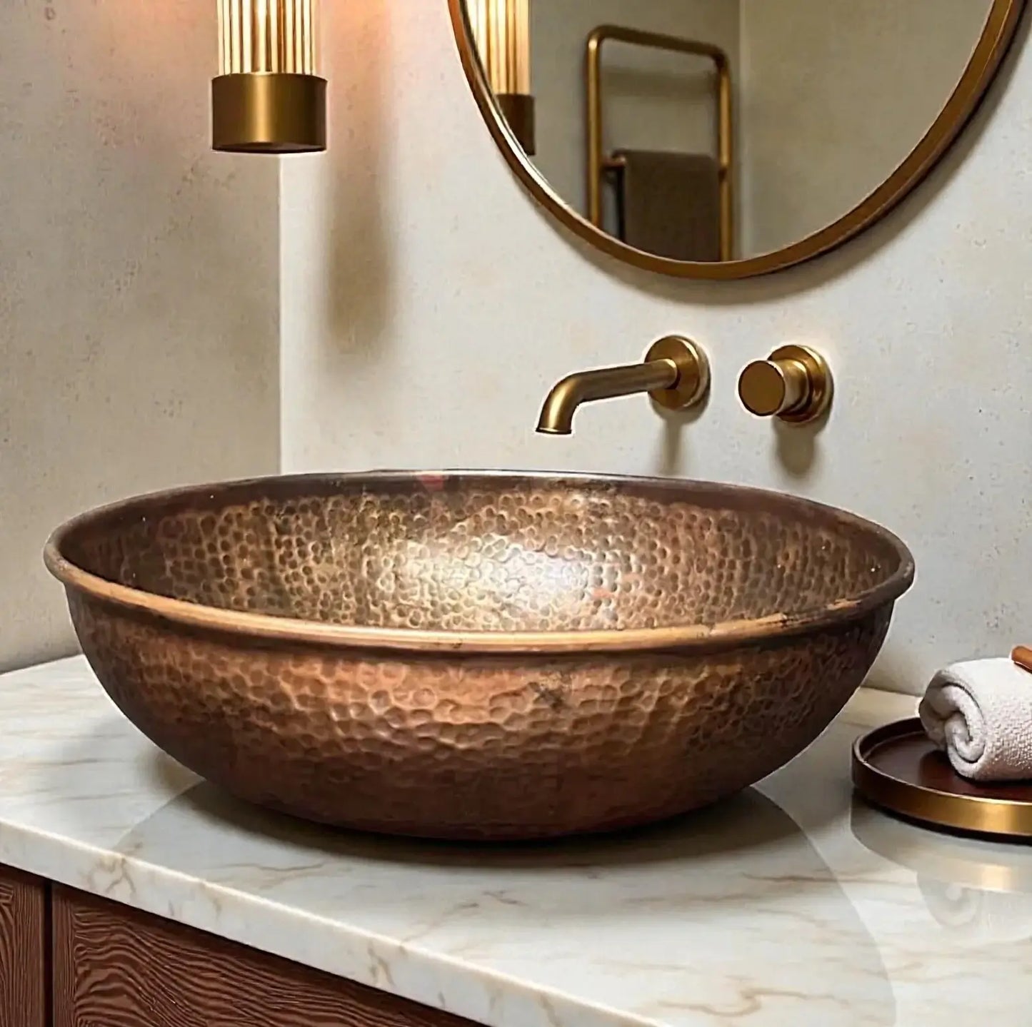 Hammered copper vessel sink placed elegantly on marble countertop with stylish bathroom fixtures.