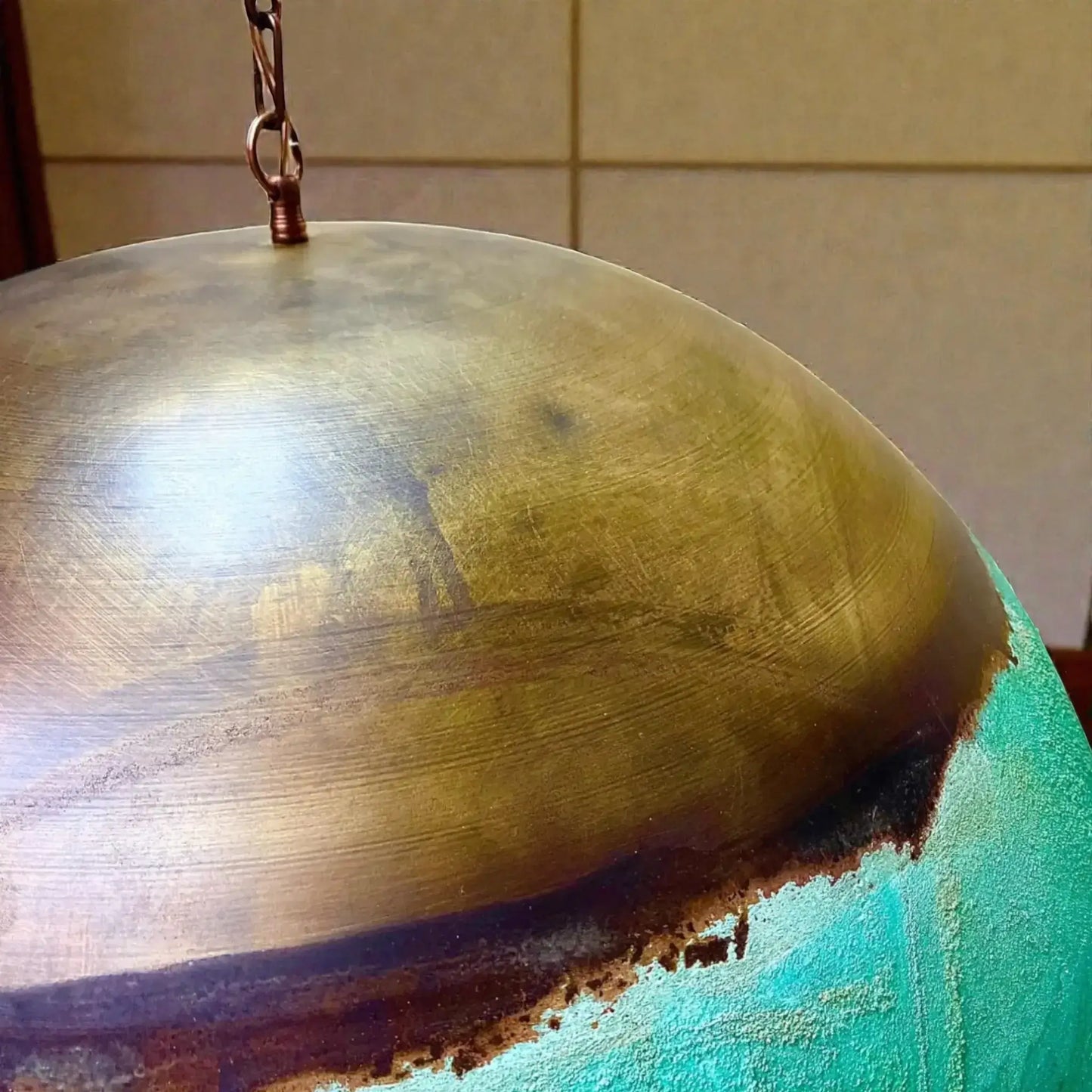 Close-up of a Copper Dome Pendant Light showcasing its unique finish and texture.