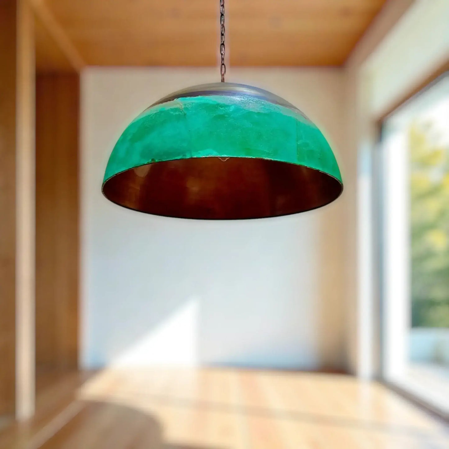 Copper Dome Pendant Light showcasing a unique design with a green exterior and copper interior, perfect for modern interiors.