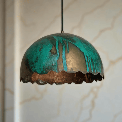 Green Patina Scalloped Copper Dome Pendant Light hanging elegantly with a turquoise finish and scalloped edges.