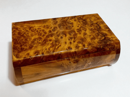 Luxury Wooden Jewelry Box – Handmade Moroccan Thuya Burl with unique amber finish and swirling grain pattern.