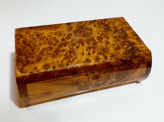 Luxury Wooden Jewelry Box – Handmade Moroccan Thuya Burl with unique amber finish and swirling grain pattern.