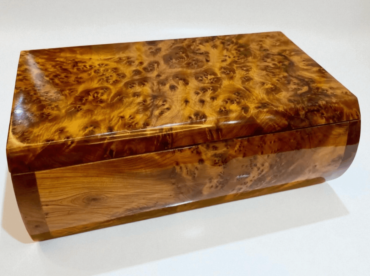 Luxury Wooden Jewelry Box – Handmade Moroccan Thuya Burl with polished amber finish and unique grain patterns.