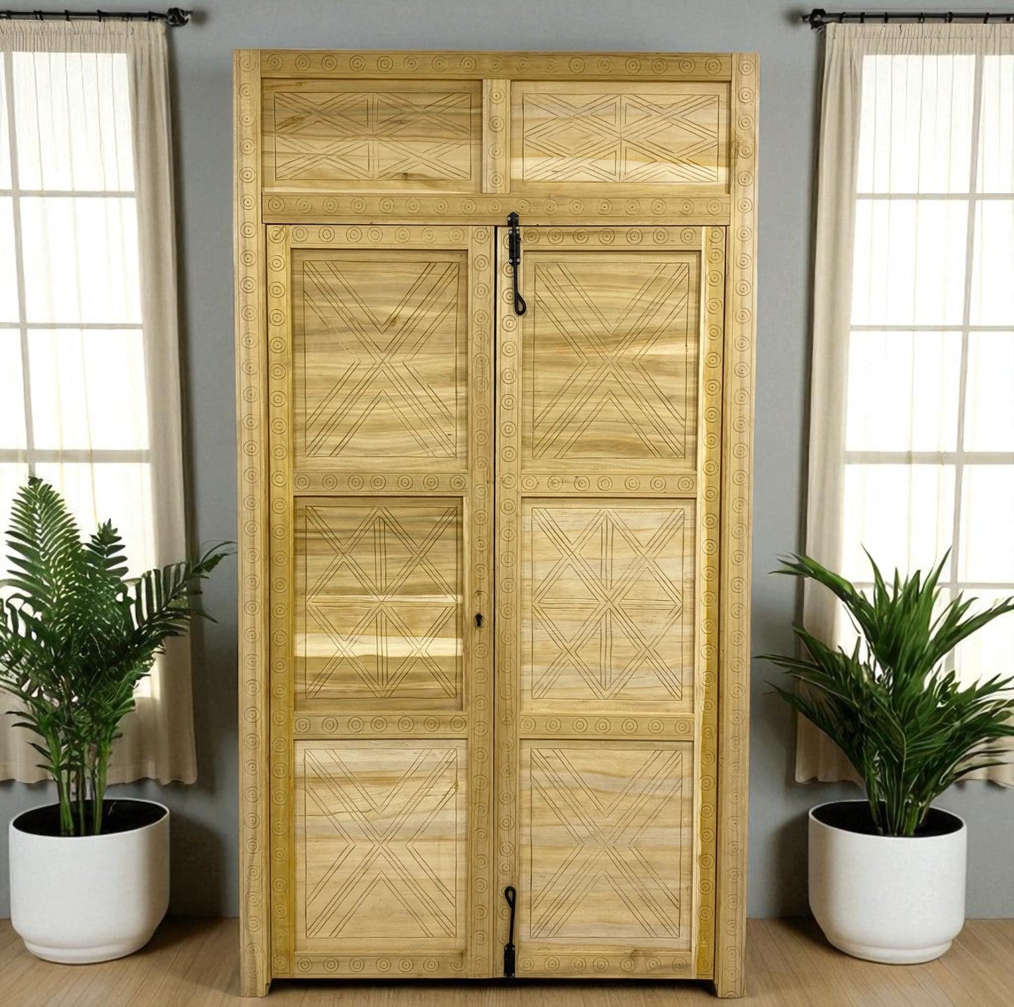Wooden cabinet with patterned doors, flanked by potted plants.
