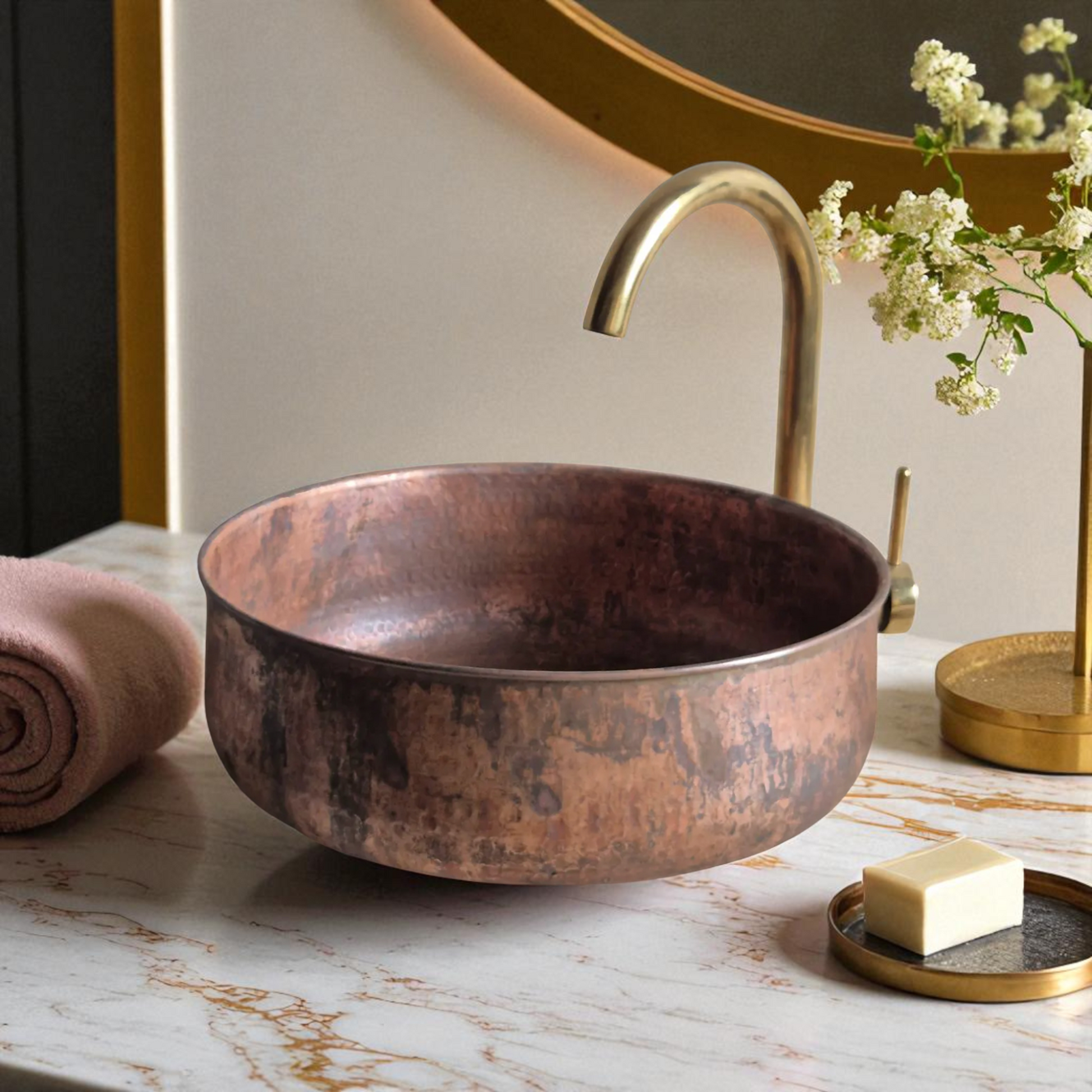 Copper sink, brass faucet, marble countertop.