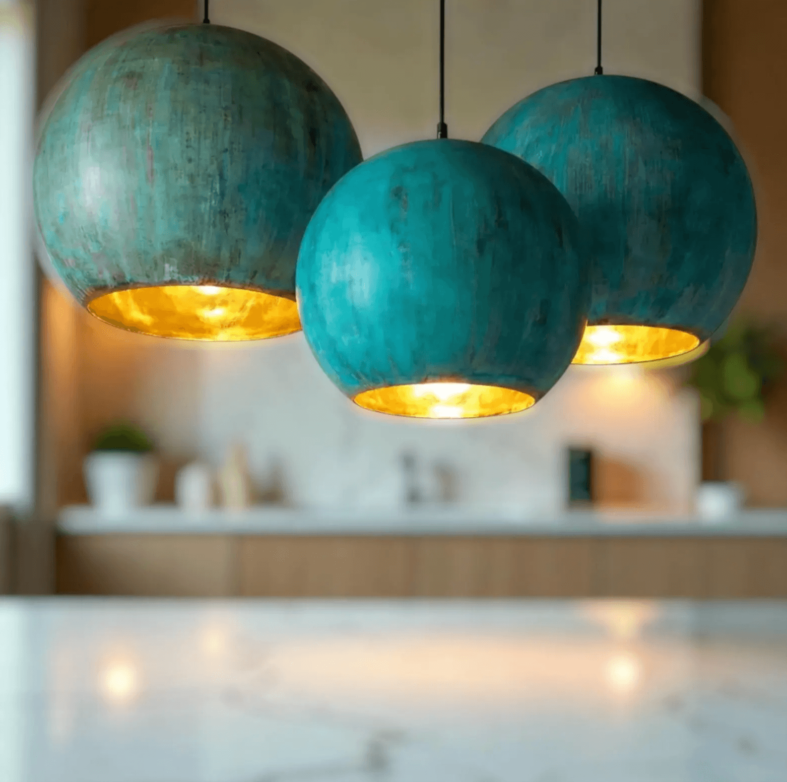 Green Patina Copper Pendant Light showcasing three textured globe designs with warm golden interiors.