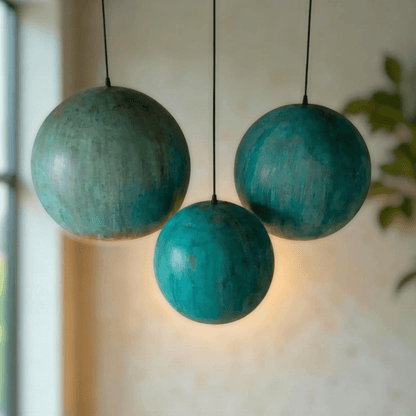 Green Patina Copper Pendant Light - elegant trio of hanging spherical lights with green patina finish.