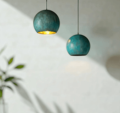 Green Patina Copper Pendant Light illuminating a modern interior space with a stylish design.
