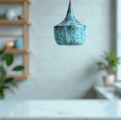 Blue pendant light hanging in a room with a blurred background
