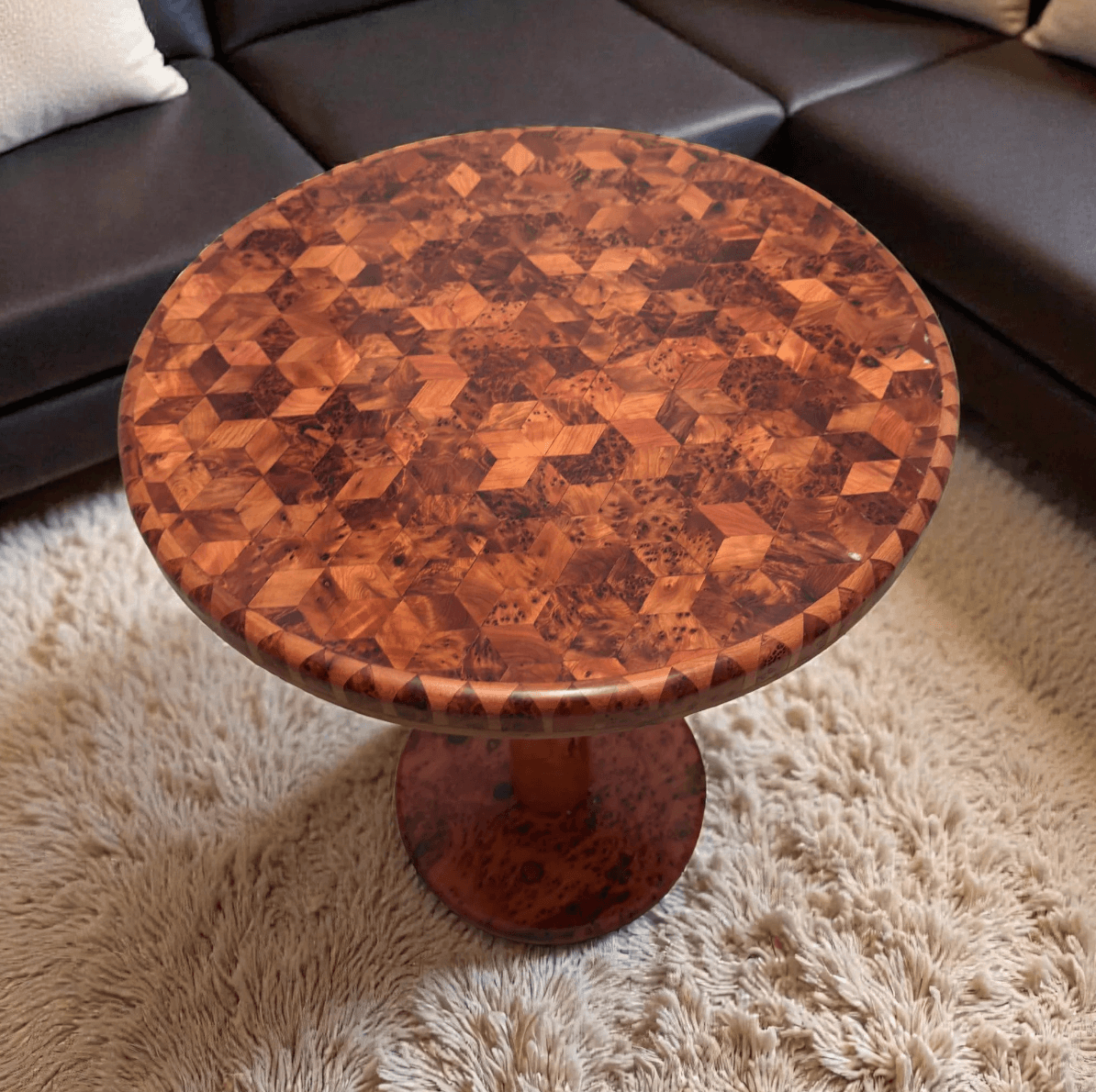 Wooden side table with geometric pattern on a fluffy rug
