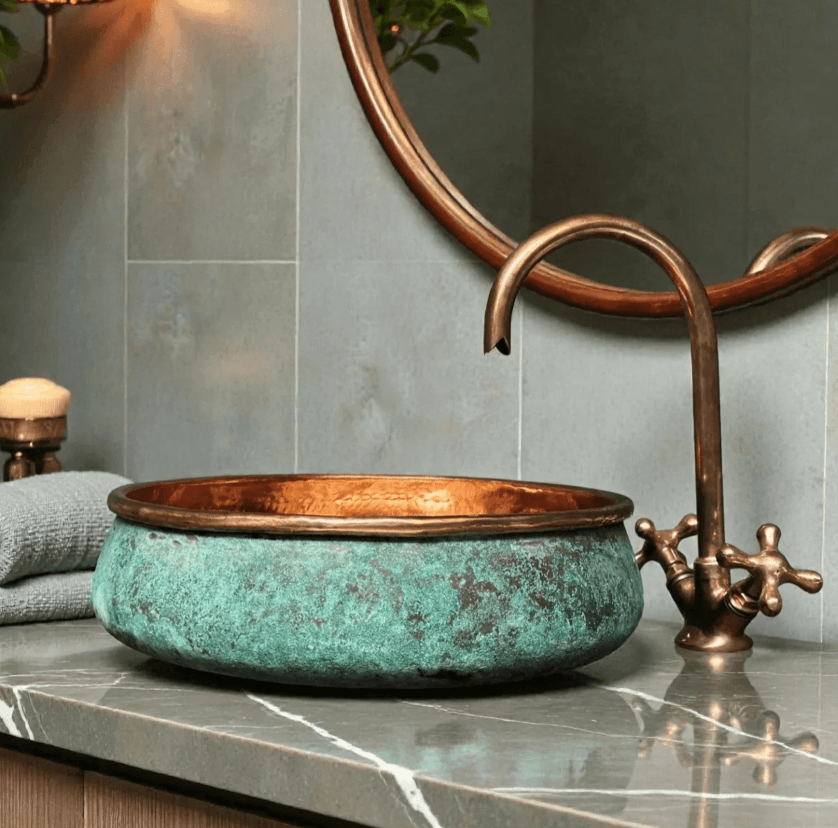 Vintage-style copper sink with faucet in a bathroom setting