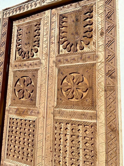 AtlasMuseCrafts antique double wood door with intricate Moorish hand-carving and geometric patterns.