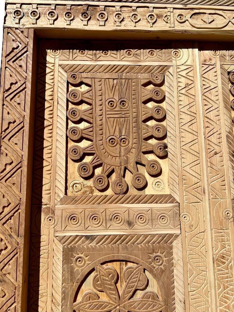 AtlasMuseCrafts antique double wood door with intricate Moorish hand-carving, arabesque and geometric patterns.