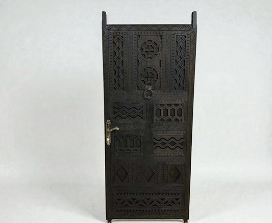 AtlasMuseCrafts dark wood door with intricate floral and geometric carvings, featuring a ring pull and ornate handle.