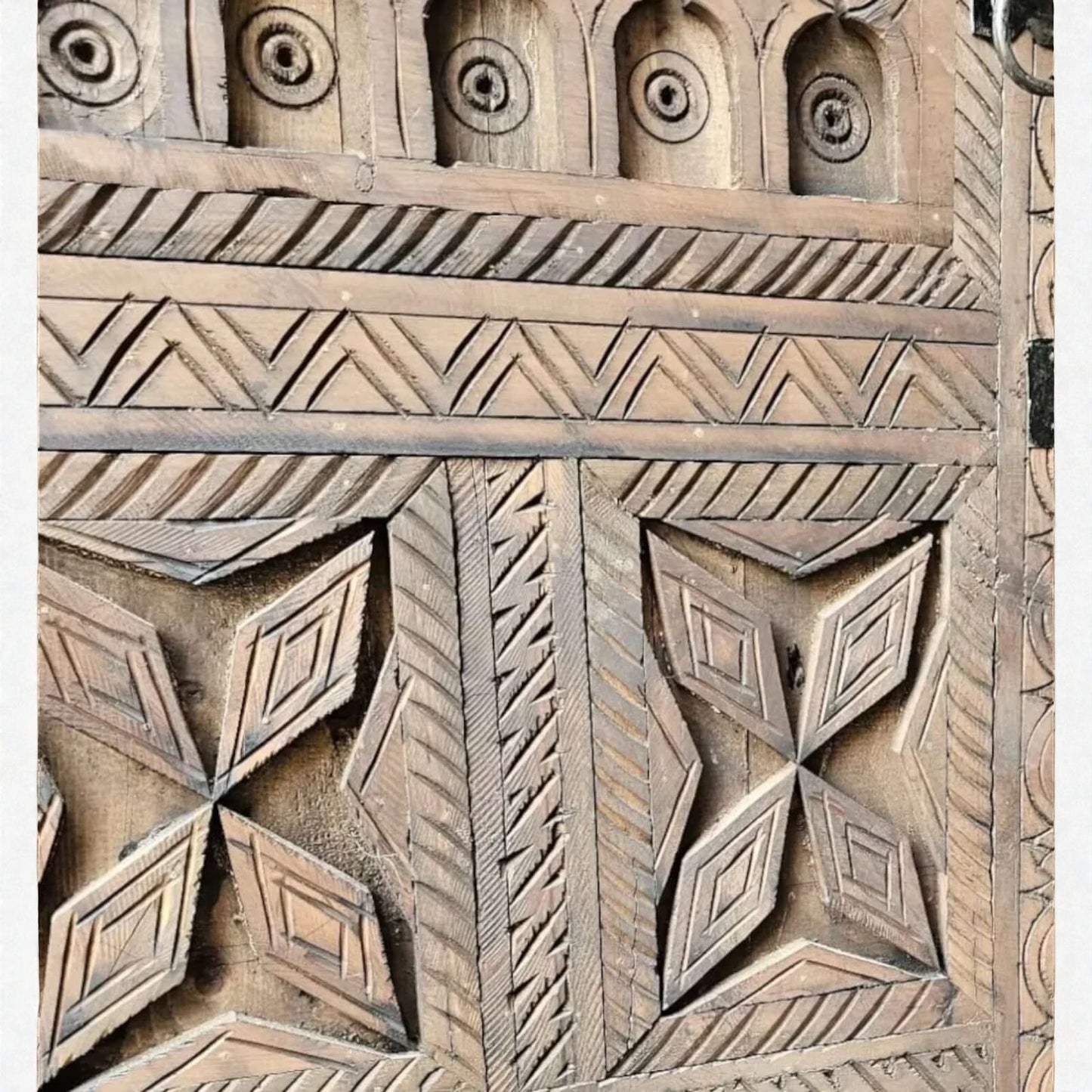 AtlasMuseCrafts handcrafted wooden cabinet with intricate Berber carvings and geometric patterns. Rustic boho style.