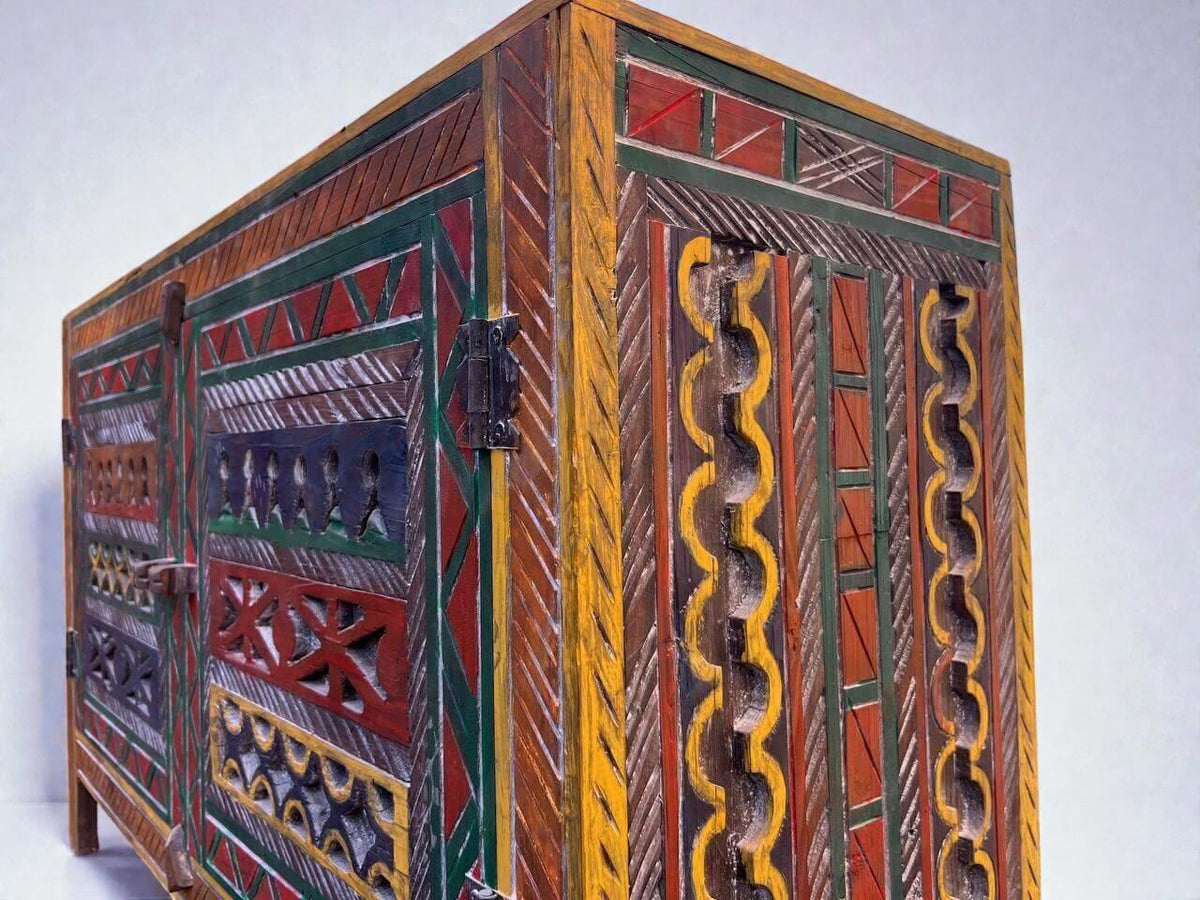 AtlasMuseCrafts handmade wooden cabinet with colorful Berber carvings and rustic boho style. Features hand-carved patterns, adjustable shelves, and durable construction.