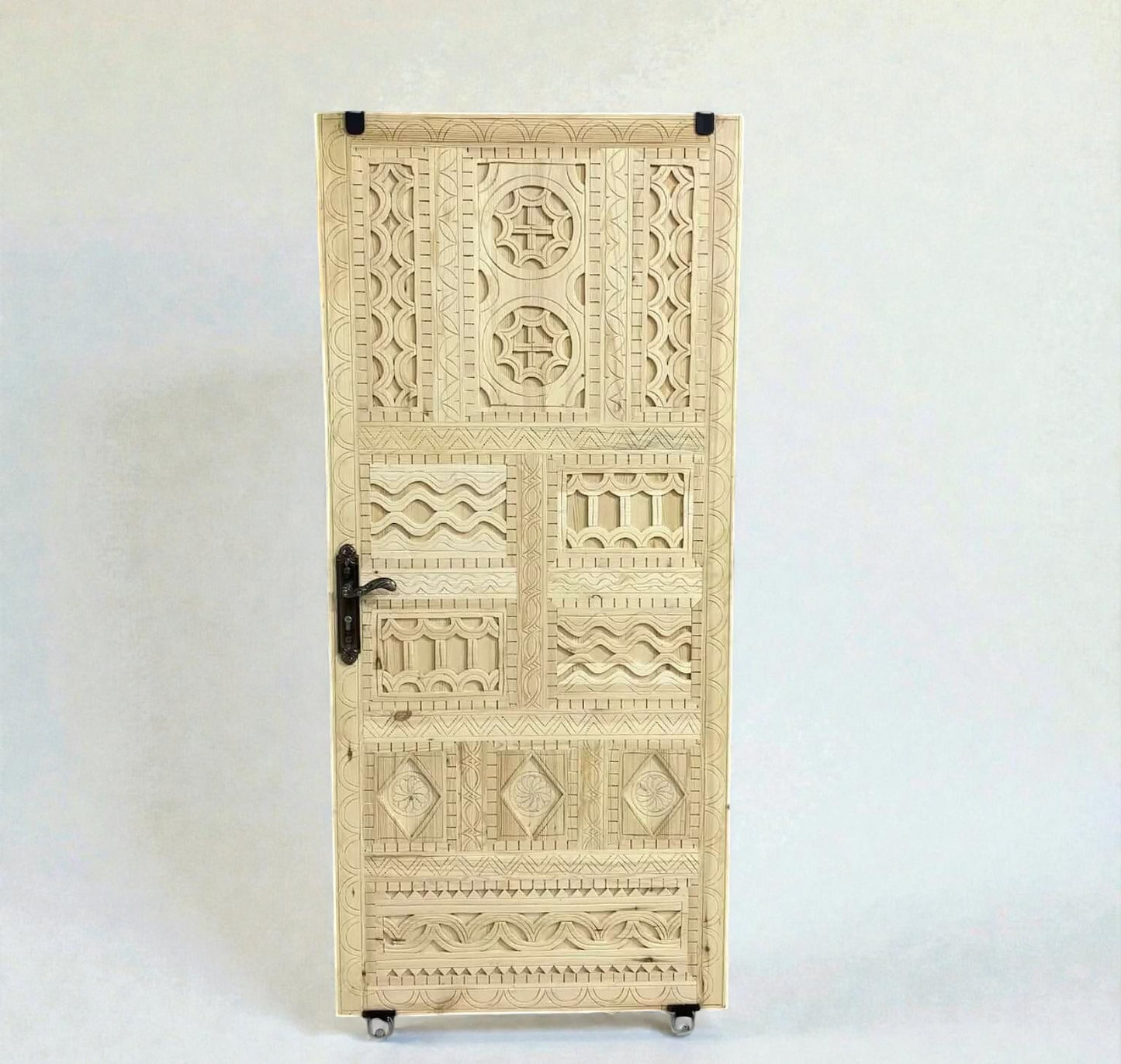 AtlasMuseCrafts vintage Moroccan carved wood door with intricate geometric and arabesque patterns. Natural wood finish.