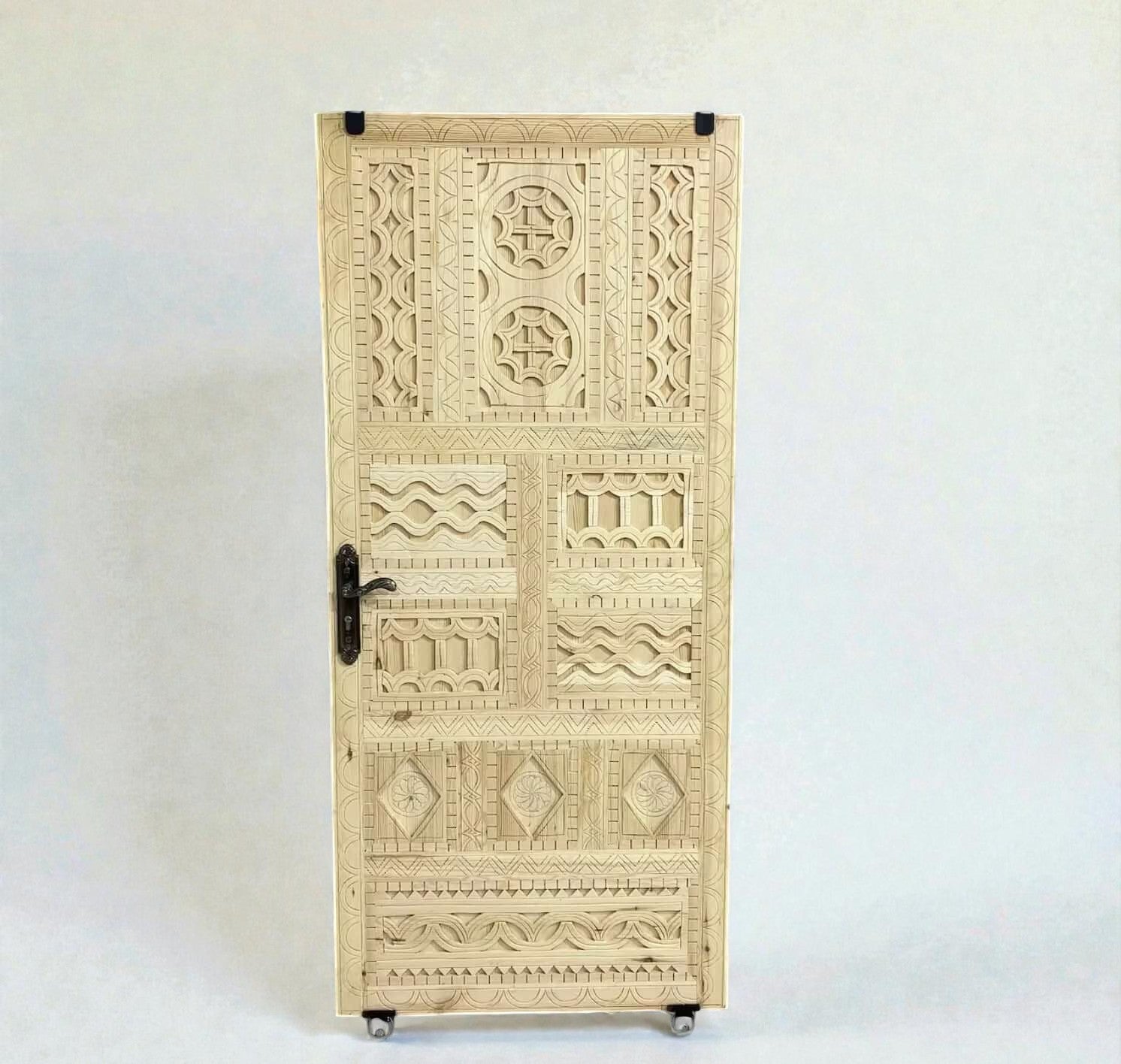 AtlasMuseCrafts vintage Moroccan carved wood door with intricate geometric and arabesque patterns. Natural wood finish.