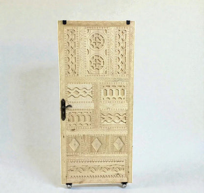 AtlasMuseCrafts vintage Moroccan carved wood door with intricate geometric and arabesque patterns. Natural wood finish.
