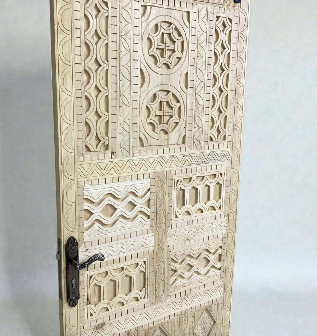 AtlasMuseCrafts vintage Moroccan carved wood door with intricate geometric and arabesque patterns. Natural wood finish.