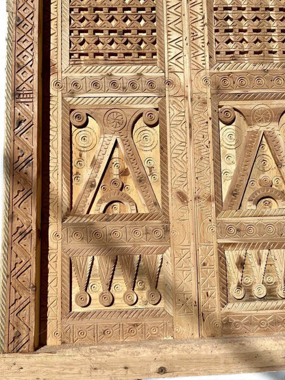 AtlasMuseCrafts antique Moroccan double door made of natural wood with intricate Moorish hand-carving and geometric patterns.
