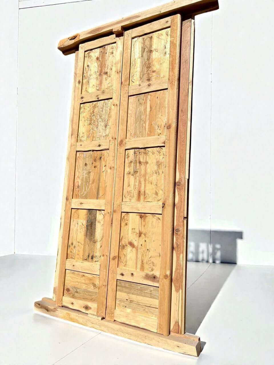 AtlasMuseCrafts antique Moroccan double door made of natural wood with heritage Moorish hand-carving and a rustic finish.