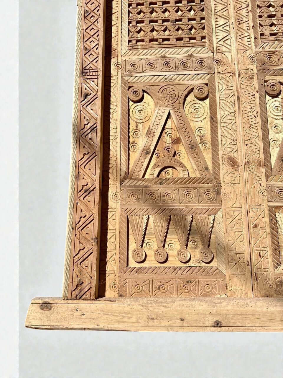 AtlasMuseCrafts antique Moroccan double door in natural wood with intricate Moorish hand-carving and geometric patterns.