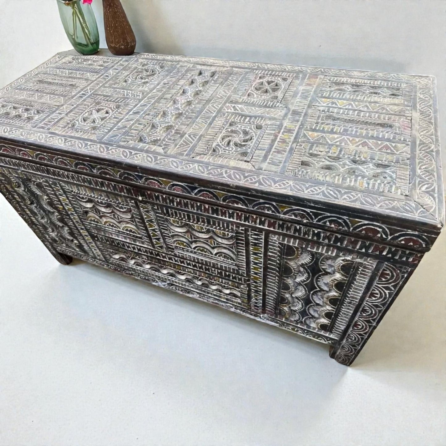 AtlasMuseCrafts handmade Moroccan storage cabinet with intricate Berber carvings, rustic boho style, and natural wood finish.