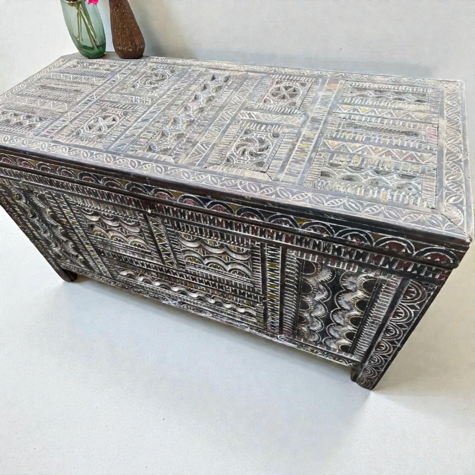 AtlasMuseCrafts handmade Moroccan storage cabinet with intricate Berber carvings, rustic boho style, and natural wood finish.