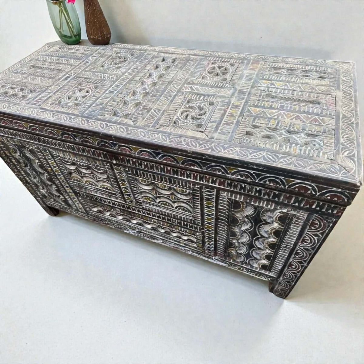 AtlasMuseCrafts handmade Moroccan storage cabinet with intricate Berber carvings, rustic boho style, and natural wood finish.