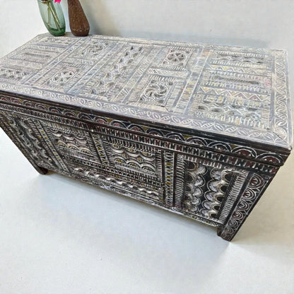 AtlasMuseCrafts handmade Moroccan storage cabinet with intricate Berber carvings, rustic boho style, and natural wood finish.