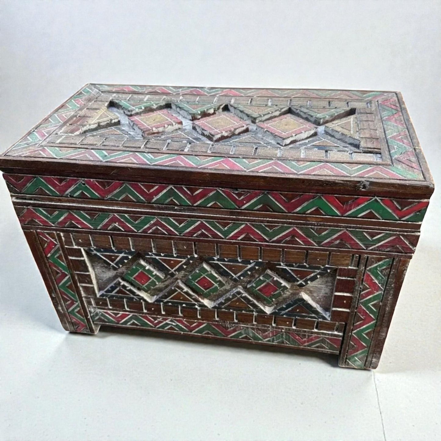 AtlasMuseCrafts custom Moroccan wood cabinet with intricate Berber carvings in red, green, and yellow. Rustic boho storage chest.