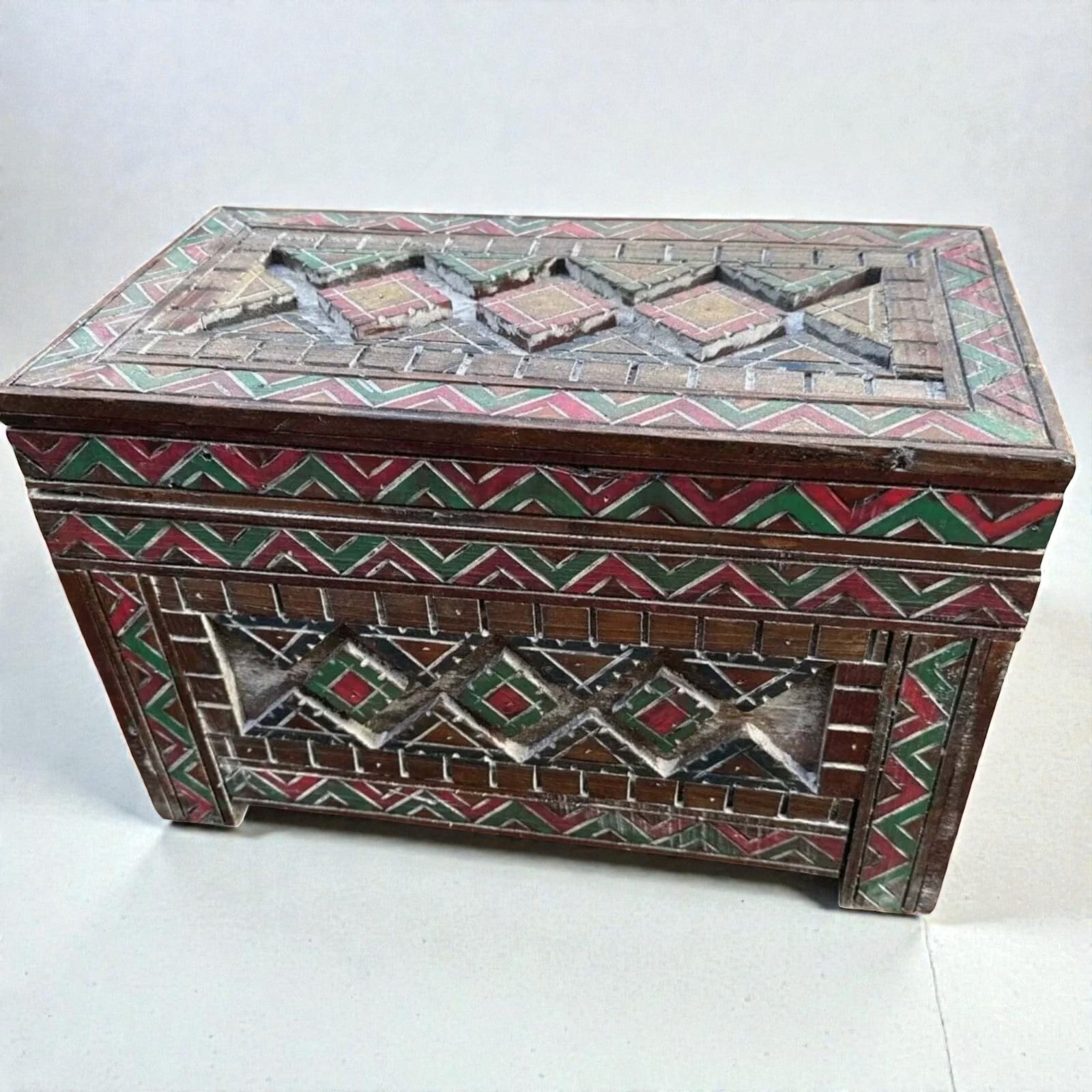 AtlasMuseCrafts custom Moroccan wood cabinet with intricate Berber carvings in red, green, and yellow. Rustic boho storage chest.
