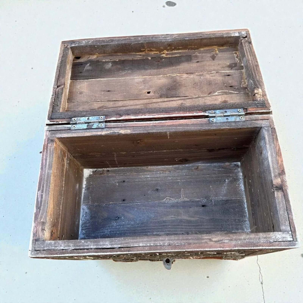 AtlasMuseCrafts rustic wooden chest with hand-carved Berber patterns and metal hinges. Ideal for storage.