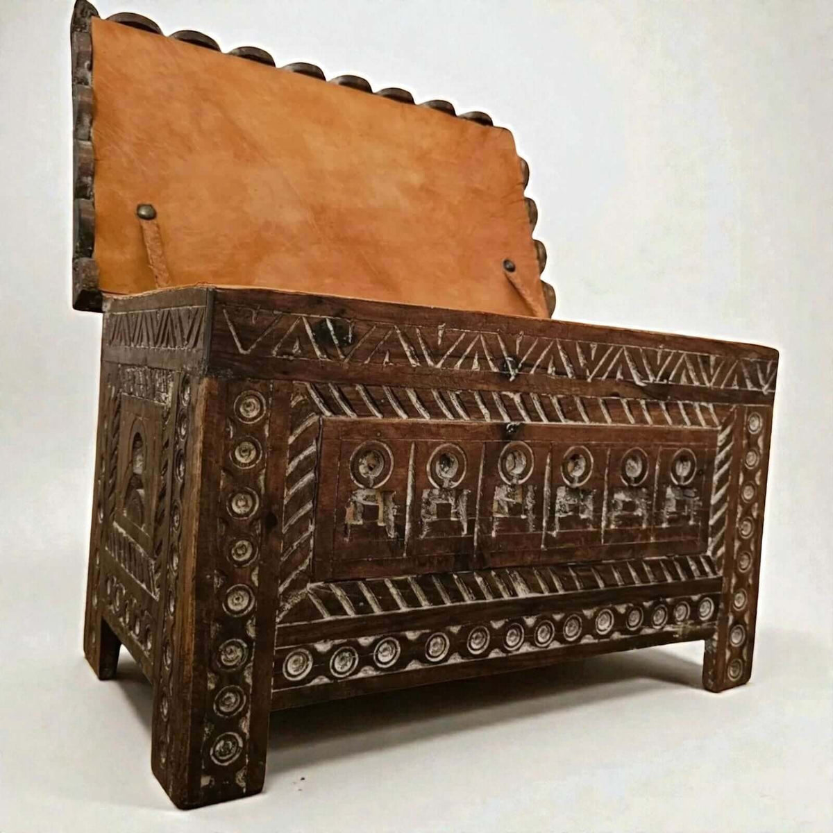 Wooden storage chest with Moroccan Berber carving and leather lid