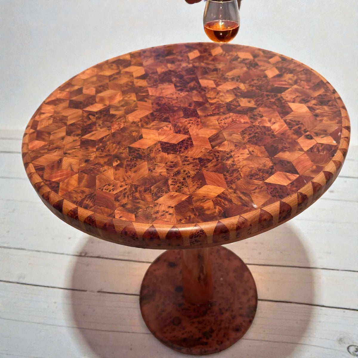 Handmade round coffee table with solid wood inlay and pedestal base