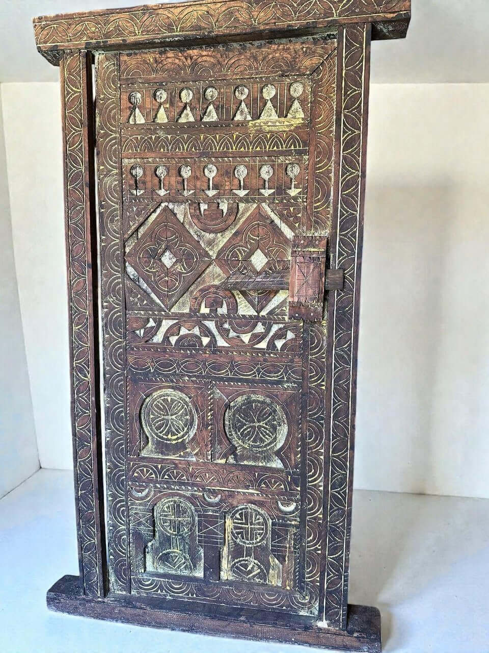 AtlasMuseCrafts vintage wooden door with floral carvings and antique brass knob. Natural wood with aged patina.
