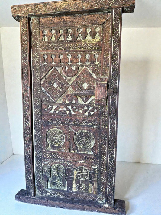AtlasMuseCrafts vintage wooden door with floral carvings and antique brass knob. Natural wood with aged patina.