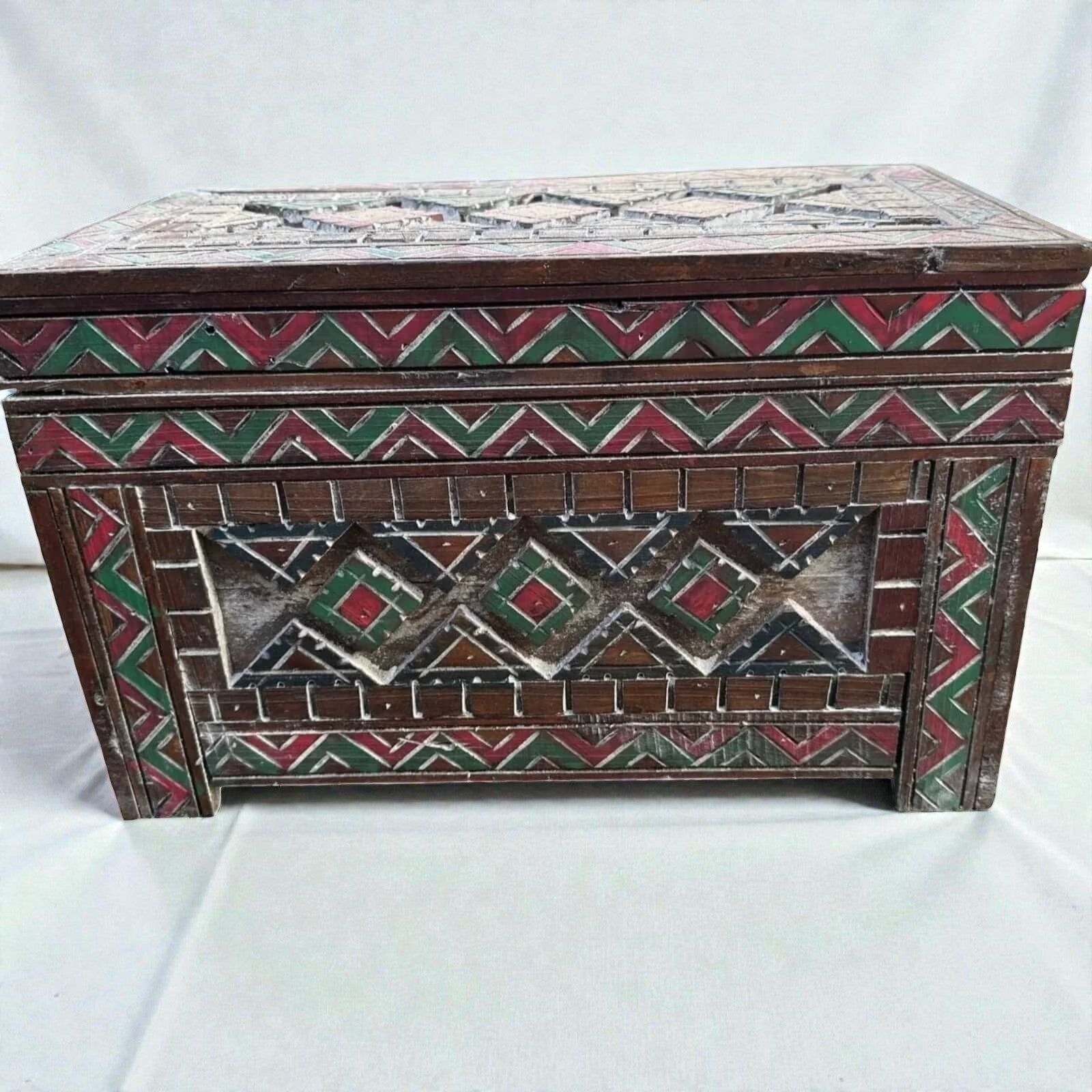 AtlasMuseCrafts handmade wooden storage cabinet with carved Berber patterns in red, green, and white. Rustic boho style.